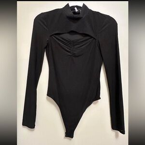 Black body suit with cut out
